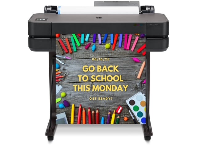 Poster making machine printing a vibrant, colorful educational poster in a classroom setting.