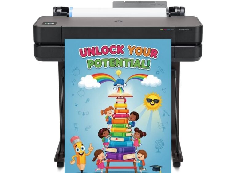 Teacher using a poster maker machine in a school to print a colorful educational chart for the classroom.