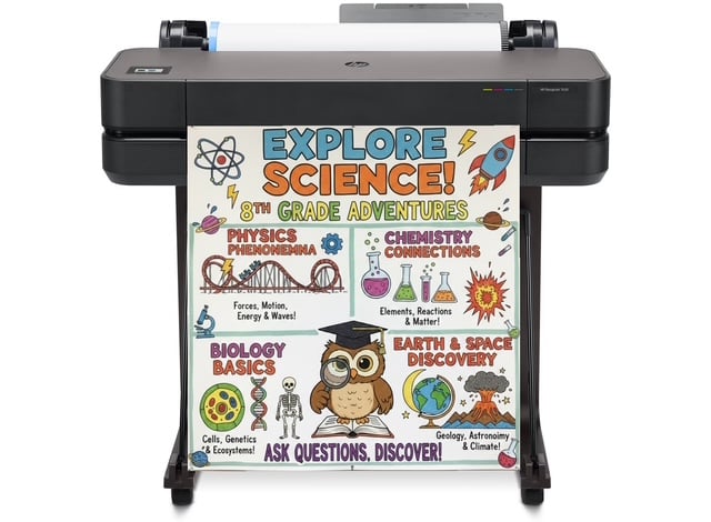 Teacher holding freshly printed colorful 24x36 STEM poster from Education Graphics poster machine for schools in vibrant classroom hallway