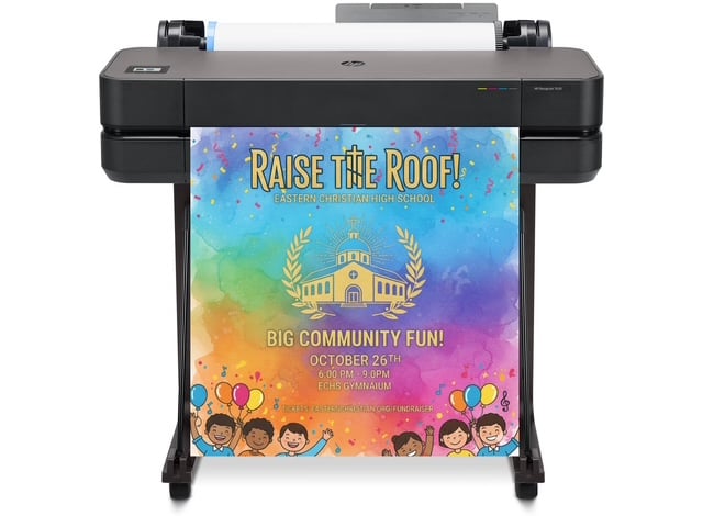 Teacher using a poster printer machine to create a large-format educational anchor chart in a K–12 classroom